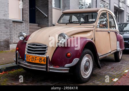 The Hague, Netherlands - October 7, 2021: Vintage buggy or beetle car parked in a street in The Hague, Netherlands. Stock Photo