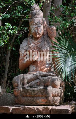 old oriental statue in a garden decoration Stock Photo - Alamy