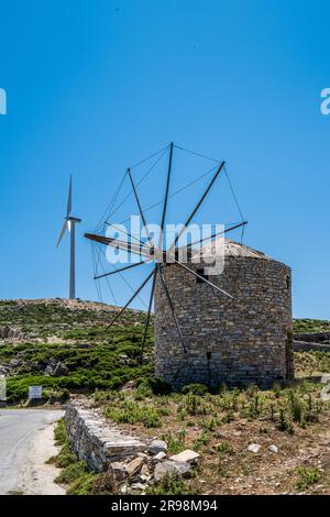 Wind farm and old windmill near Koronos village on Naxos island. Greece Stock Photo