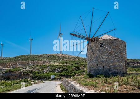 Wind farm and old windmill near Koronos village on Naxos island. Greece Stock Photo