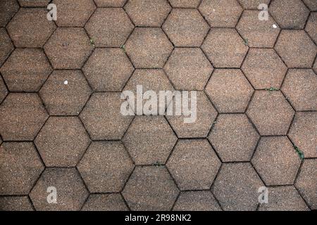 Street pavement with hexagonal polyhedron blocks, urban texture with a slight perspective Stock Photo