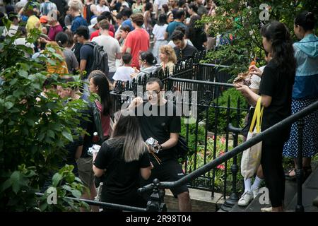 New York, USA. 24th June, 2023. People attend the Dragon Fest in New York, the United States, on June 24, 2023. A brand-new Chinese food and culture festival won New Yorkers' hearts and stomachs on Saturday with its debut on a section of a street at Washington Square Park in Lower Manhattan.TO GO WITH 'Feature: Chinese food, culture festival draws throngs of New Yorkers' Credit: Michael Nagle/Xinhua/Alamy Live News Stock Photo