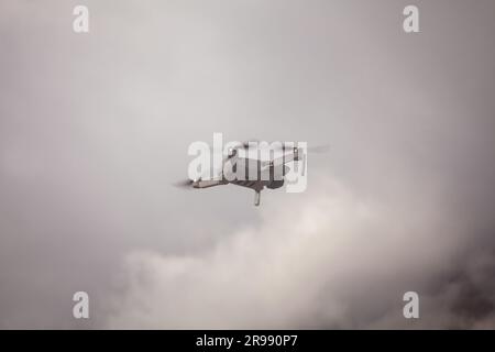 drone flying in the cloudy sky, photo as a background, digital image Stock Photo