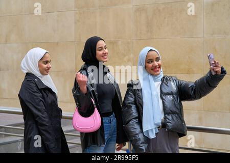 Three arab friends taking selfie. Young muslim women lifestyle Stock Photo