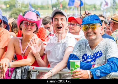Glastonbury, UK. 25th June, 2023. Fans (many already in Elton John outfits) watch as Sophie Ellis-Bexter plays the Pyramid stage and includes a song as tribute to her husband, guitar player, as it is their wedding anniversary - unday at the 2023 Glastonbury Festival, Worthy Farm, Glastonbury. Credit: Guy Bell/Alamy Live News Stock Photo