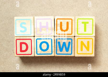 Wooden alphabet letter block in word shut down on wood background Stock Photo
