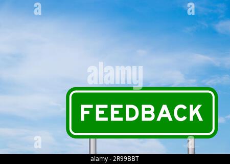 Green color transportation sign with word feedback on blue sky with white cloud background Stock Photo