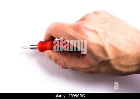 man of man that hold a screwdriver with handle rubber of red color on the white background Stock Photo