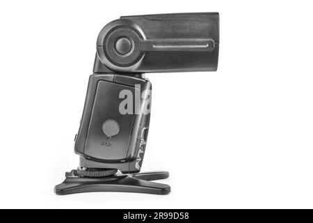 Black camera flash on the stand isolate Stock Photo