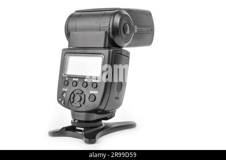 Black camera flash on the stand isolate Stock Photo