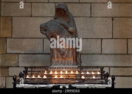 A statue of The Virgin Mary and Jesus Christ. Light a candle for someone's memory. Stock Photo