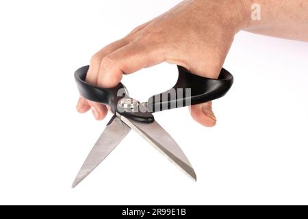 hand with black scissors in white background isolate Stock Photo