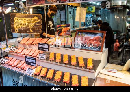 Tokyo Japan 11th Mar 2023: the A5 wagyu beef stick on sale from food stall in Tsukiji Outer Market. It is Japan’s “Food Town,” where one can encounter Stock Photo