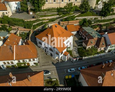 Aerial view of restored Baroque Mikulov castle in Southern Bohemia also called Nikolsburg with medieval towers surrounded by communist style houses Stock Photo