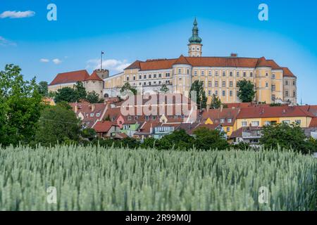 Aerial view of restored Baroque Mikulov castle in Southern Bohemia also called Nikolsburg with medieval towers surrounded by communist style houses Stock Photo