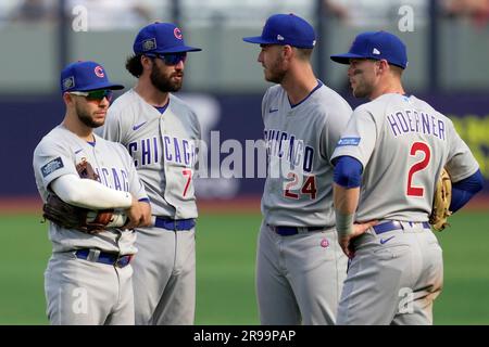 From left to right, Chicago Cubs' Nick Madrigal, Dansby Swanson (7