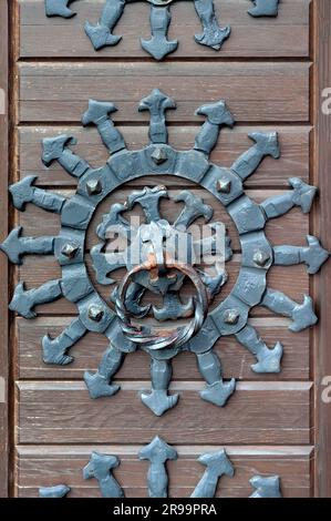 Handle knocker of an antique wooden door of Golden Gates in Kyiv Ukraine Stock Photo