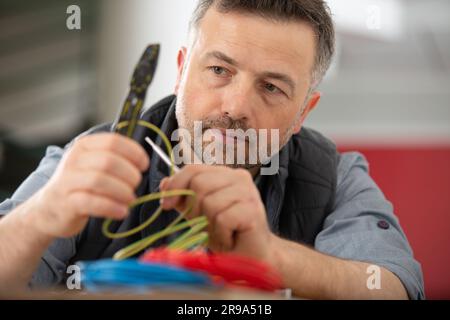 electrician engineer tests electrical installations Stock Photo