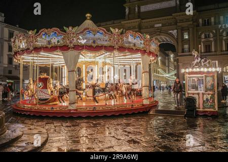 Florence, Italy - 22 Nov, 2022: Night reflections of the Carousel in Piazza della Repubblica Stock Photo