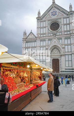 Florence, Italy - 22 Nov, 2022: Christmas Market in Piazza Santa Croce and the Basilica di Santa Croce di Firenze Stock Photo