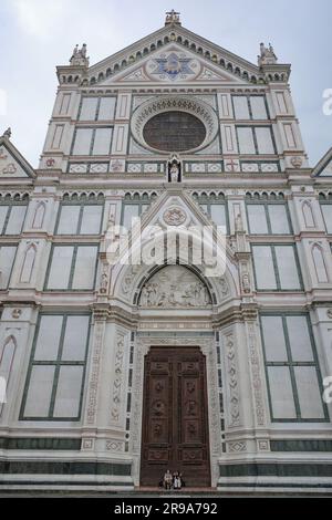 Florence, Italy - 22 Nov, 2022: Christmas Market in Piazza Santa Croce and the Basilica di Santa Croce di Firenze Stock Photo