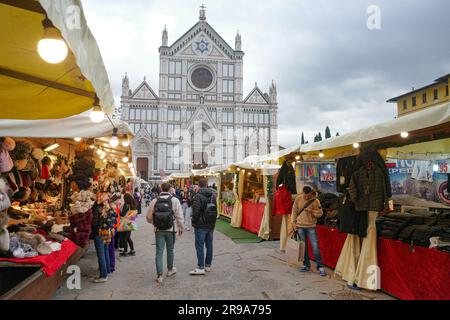Florence, Italy - 22 Nov, 2022: Christmas Market in Piazza Santa Croce and the Basilica di Santa Croce di Firenze Stock Photo
