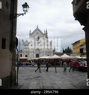 Florence, Italy - 22 Nov, 2022: Christmas Market in Piazza Santa Croce and the Basilica di Santa Croce di Firenze Stock Photo