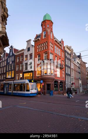 Amsterdam, the Netherlands - October 12, 2021: Street view and generic architecture in Amsterdam with typical Dutch style buildings. Amsterdam is one Stock Photo