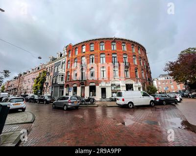Amsterdam, the Netherlands - October 12, 2021: Street view and generic architecture in Amsterdam with typical Dutch style buildings. Amsterdam is one Stock Photo