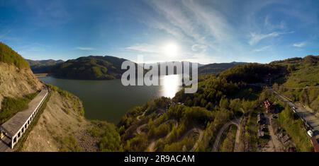 Panoramic aerial shot of Siriu Lake in Romania during early may on a sunny day. Stock Photo