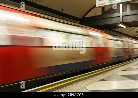 Underground tube train arriving / pulling away from the platform at Chalk Hill, London, showing movement blur. Concept: tube strikes, driver strike Stock Photo
