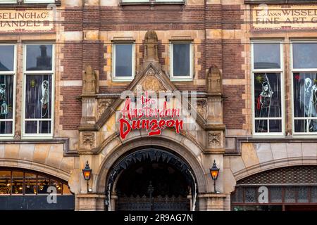 Amsterdam, NL - OCT 10, 2021: Logo sign and entrance of the Amsterdam Dungeon, a horror-themed entertainment brand operated by Merlin Entertainments. Stock Photo