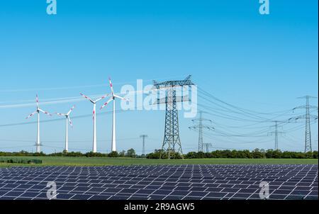 Solar cells, electricity pylons and wind turbines in Germany Stock Photo