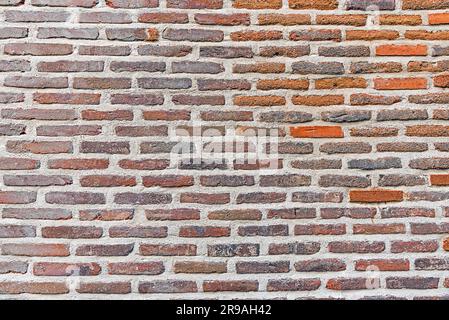 Background from an old and worn red brick wall Stock Photo