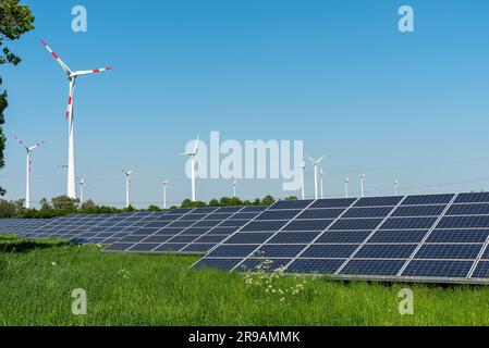 Wind turbines and solar cells in Germany Stock Photo