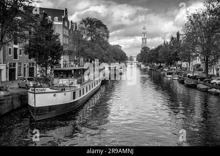 Amsterdam, the Netherlands - October 14, 2021: Canals and typical dutch architecture in Amsterdam, the capital of the Netherlands. Amsterdam is one of Stock Photo