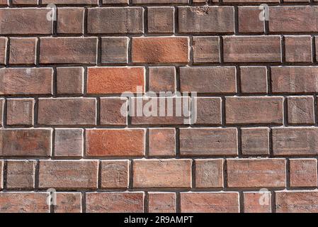Background from a dark red brick wall Stock Photo