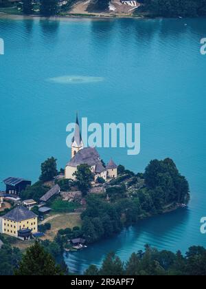 Aerial view of the church of Maria Worth (Maria Wörth) at Worthersee (Wörthersee) in the summer as seen from the Pyramidenkogel lookout tower Stock Photo