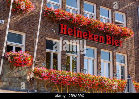 Maastricht, Holland - October 16, 2021: Signage of the dutch beer brand Heineken, the most bier company of the Netherlands. Wall of a cafe or pub serv Stock Photo
