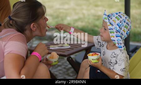 Prague, Czech Republic. 25th June, 2023. People enjoy ice cream during the Prague Ice Cream Festival in Prague, the Czech Republic, on June 25, 2023. The two-day event concluded here on Sunday. Credit: Dana Kesnerova/Xinhua/Alamy Live News Stock Photo