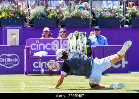 London, Britain. 25th June, 2023. Australia's Alex de Minaur falls during the final match against Spain's Carlos Alcaraz at the Queens Club tennis tournament in London, Britain, June 25, 2023. Credit: Stephen Chung/Xinhua/Alamy Live News Stock Photo