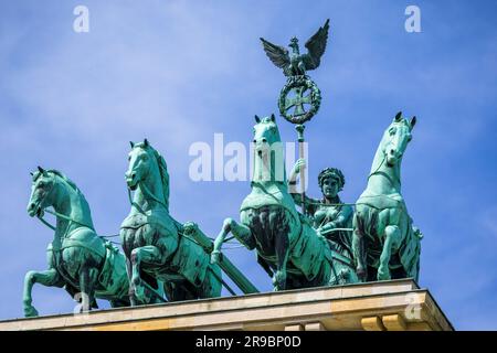 Berlin, Germany - May 31, 2023: The bronze sculpture Quadriga on top of the Brandenburg Gate in Berlin, Germany Stock Photo