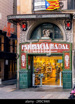 Barcelona, Spain - February 10, 2022: Old and ornate pharmacy facade, Farmacia Hadal in the Rambla Street, Barcelona city, Catalonia, Spain. Stock Photo
