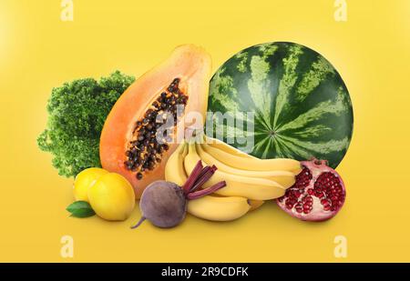 Fresh fruits, parsley and beetroot on golden background Stock Photo