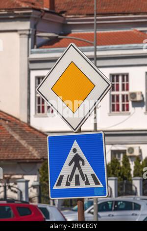 Priusr Crossing Sign Traffic signs / pedestrian crossing and priority road Stock Photo - Alamy