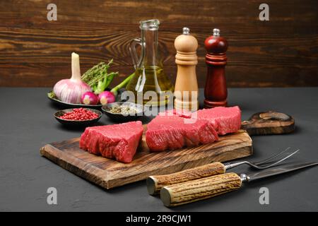 Three large raw tri-tip loin beef steaks Stock Photo