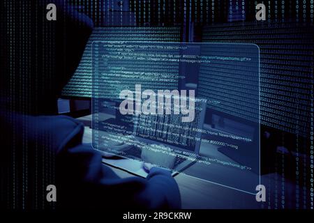 Cyber attack. Hacker working with computers and breaking system to steal information in dark room. Binary code and virtual screen near him Stock Photo
