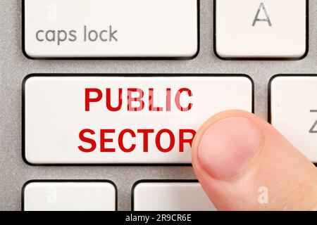Man pressing button with text Public Sector on computer keyboard, closeup Stock Photo