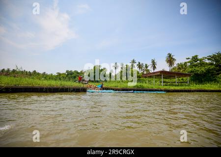 Damnoen Saduak - Thailand May 23, 2023. On the canals of Damnoen Saduak Floating Market by boat. Stock Photo