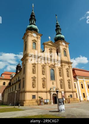 Velehrad, Czech Republic, june 2023:Papal coat of arms on cross in front of the Pilgrimage Basilica of the Assumption of the Virgin Mary and St. Cyril Stock Photo